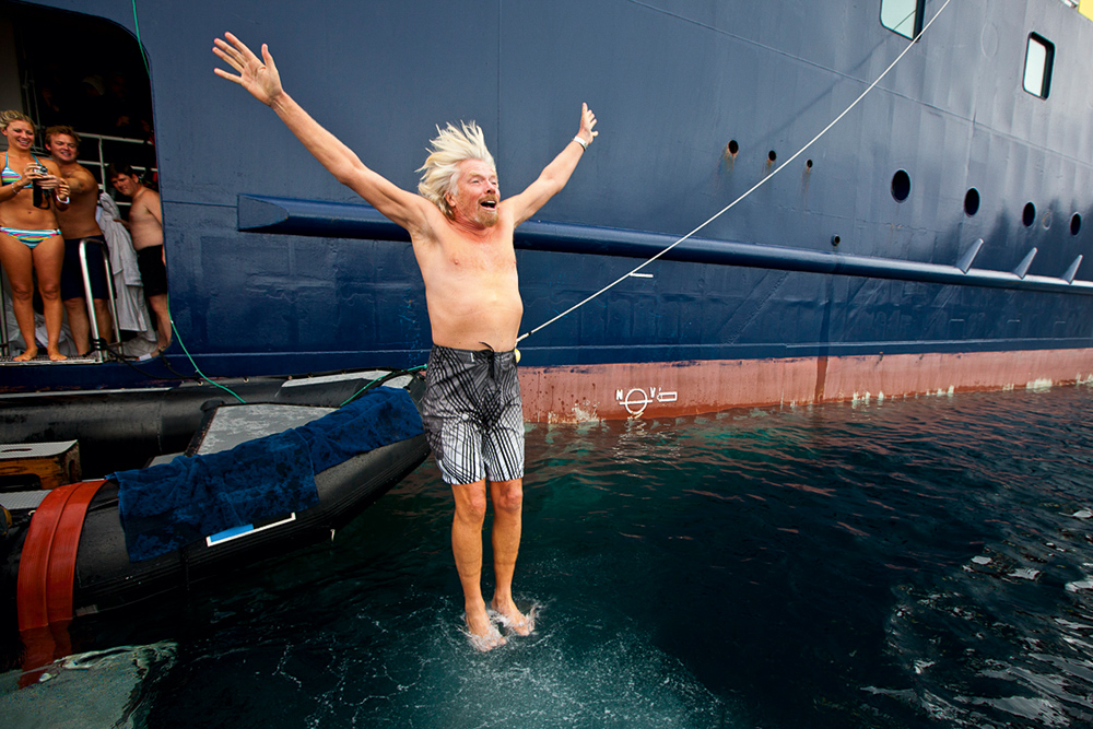 Richard Branson kiteboarding with naked model in the British Virgin Islands